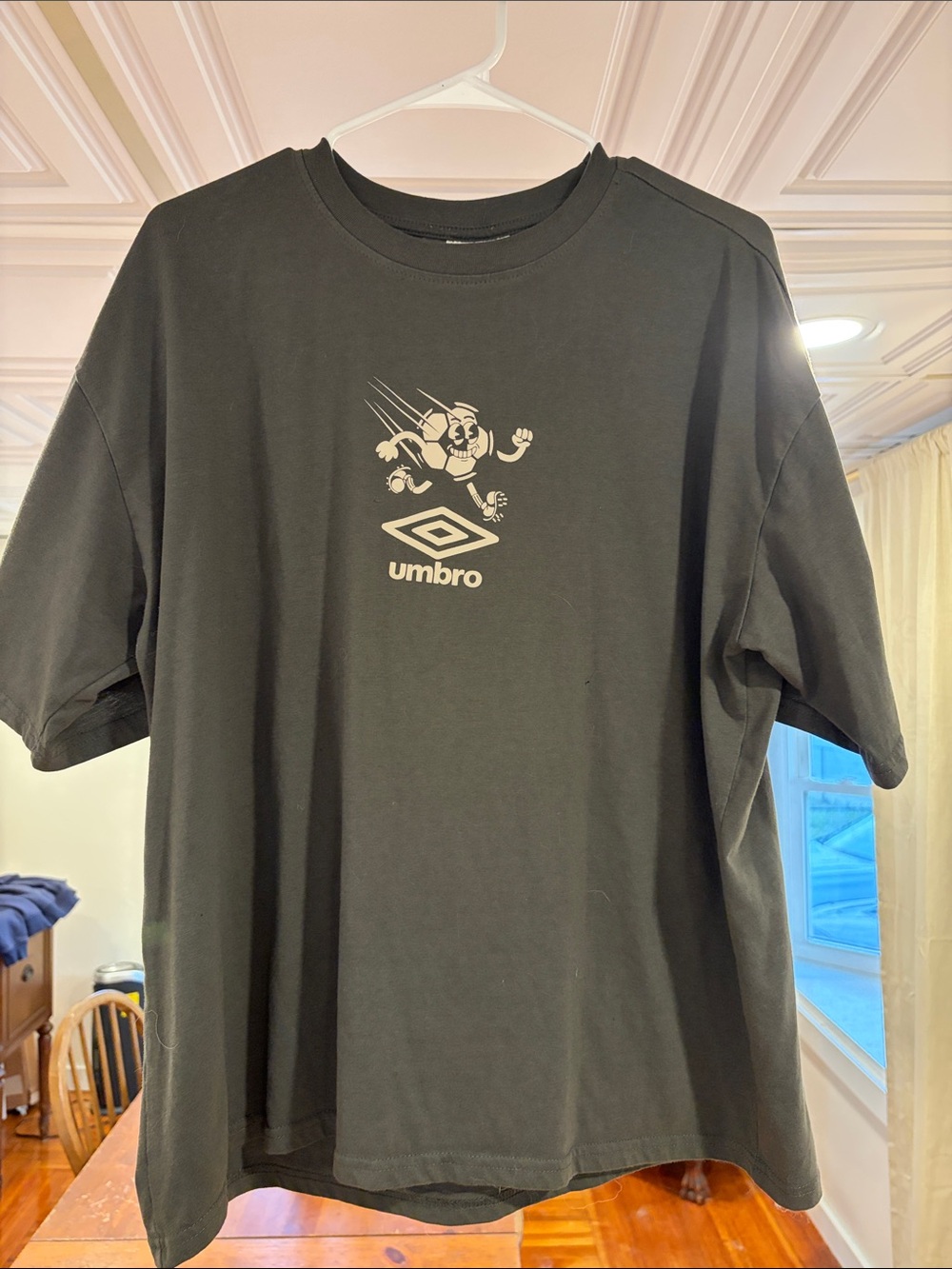 Umbro Black Short Sleeve Tee with Cream Logo Graphic